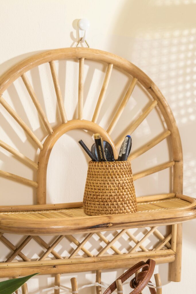 Elegant wall shelf with a wicker basket in sunlight.