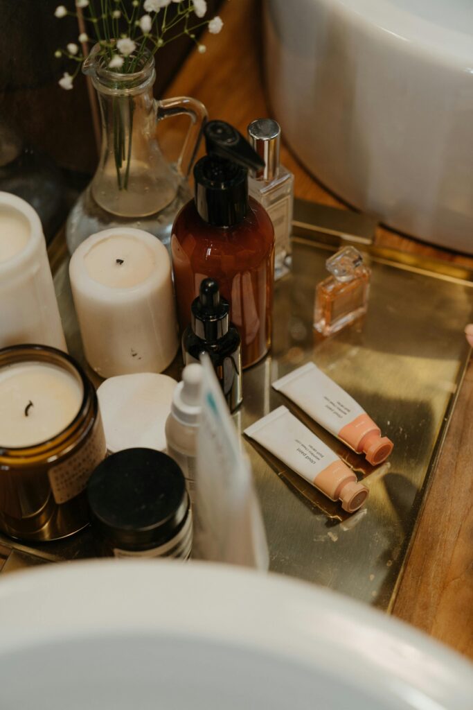 Aesthetic arrangement of skincare and beauty products on a stylish bathroom vanity.