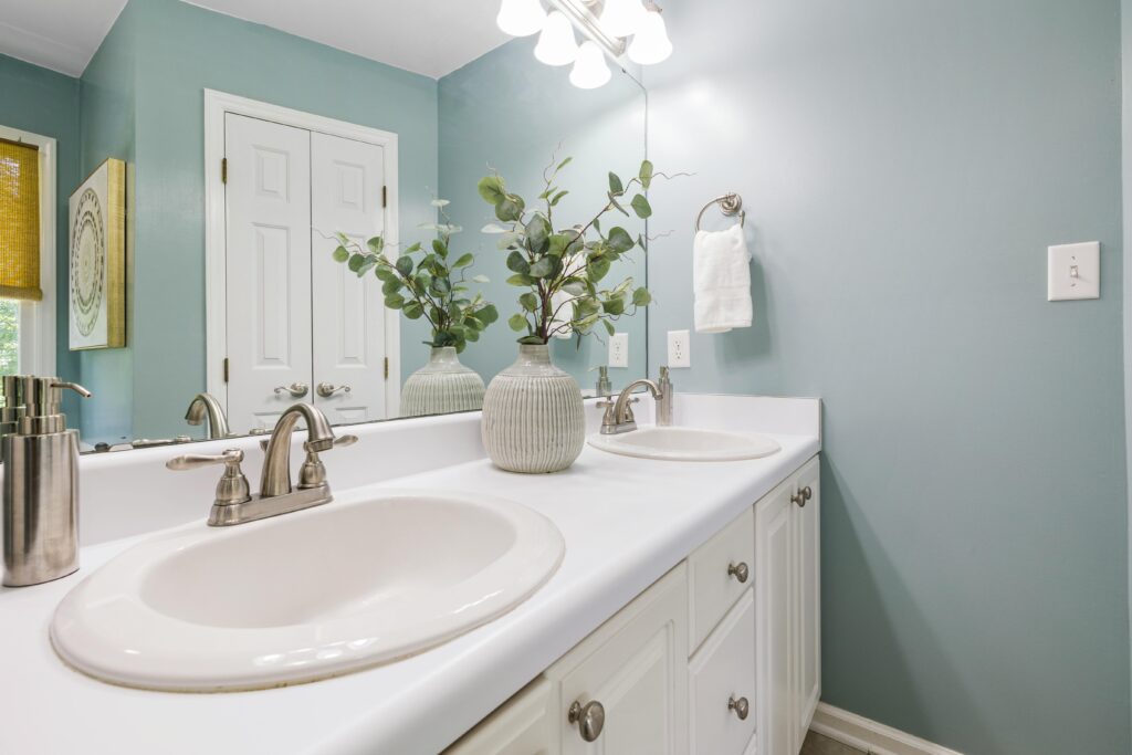 Bright contemporary bathroom featuring double sinks and minimalist decor.