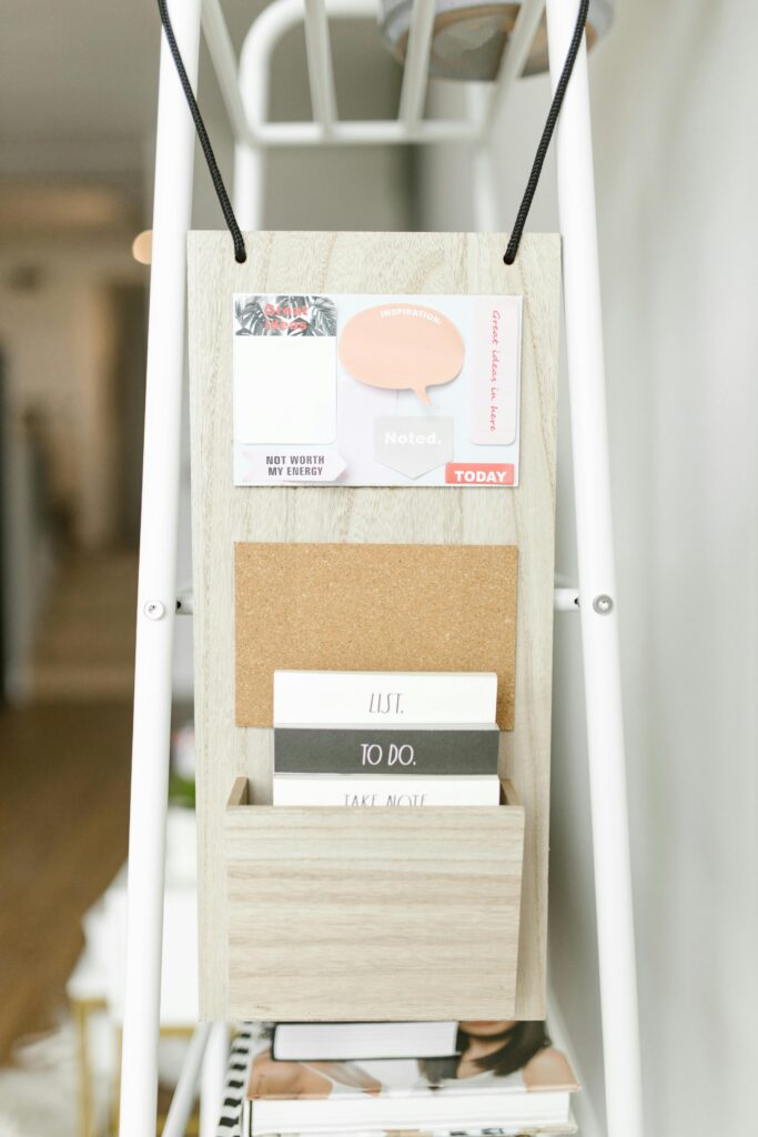 Close-up of a decorative wall organizer with cards and notepads. Perfect for organizing spaces.