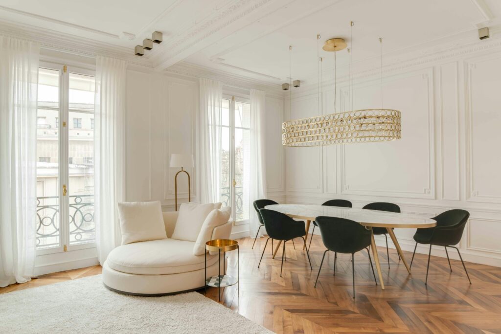 Sophisticated white-themed room with modern furniture and chic decor, perfect for elegant gatherings.