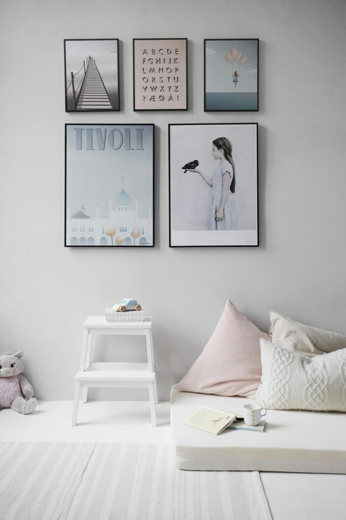 pexels-photo-462235-462235 Minimalist Scandinavian bedroom with wall art and cozy decor elements.