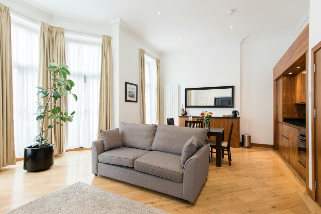 Bright and luxurious living room with modern furnishings in London apartment.